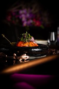 Grilled vegetable dish served with garnish